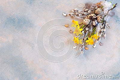 Easter decoration â€“ willow, narcissus, bunny figurines and natural eggs. Top view, close up, flat lay on light concrete Stock Photo